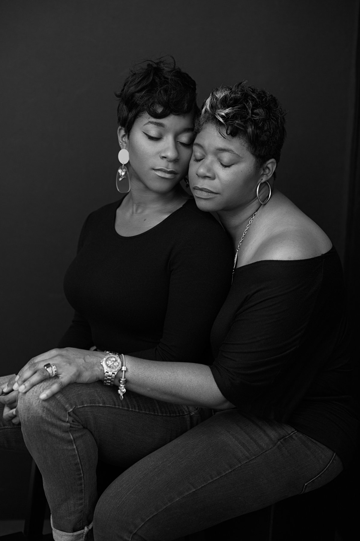 An African American black mother and daughter pose for a black and white image portrait for Janel Lee Photography studio in Cincinnati Ohio