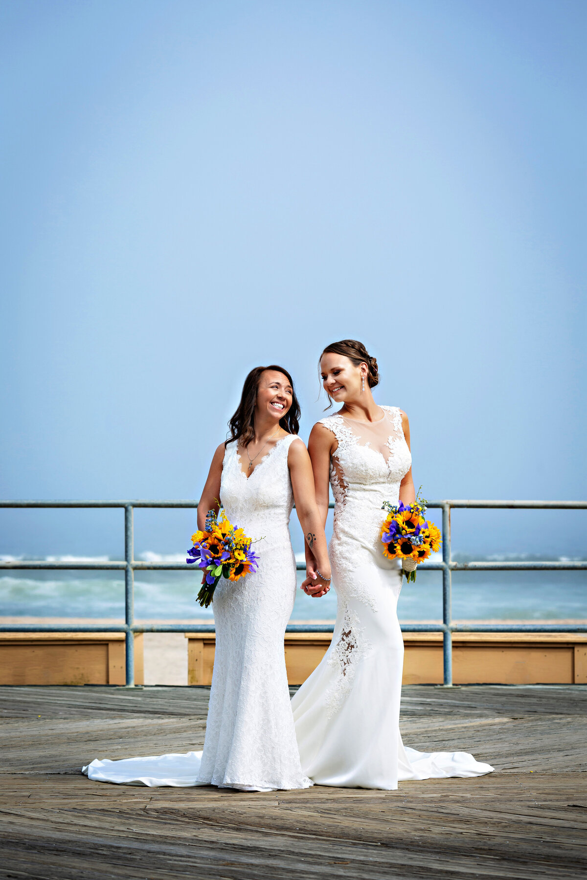 same-sex-couple-holding-hands-smiling-nj-marlboro