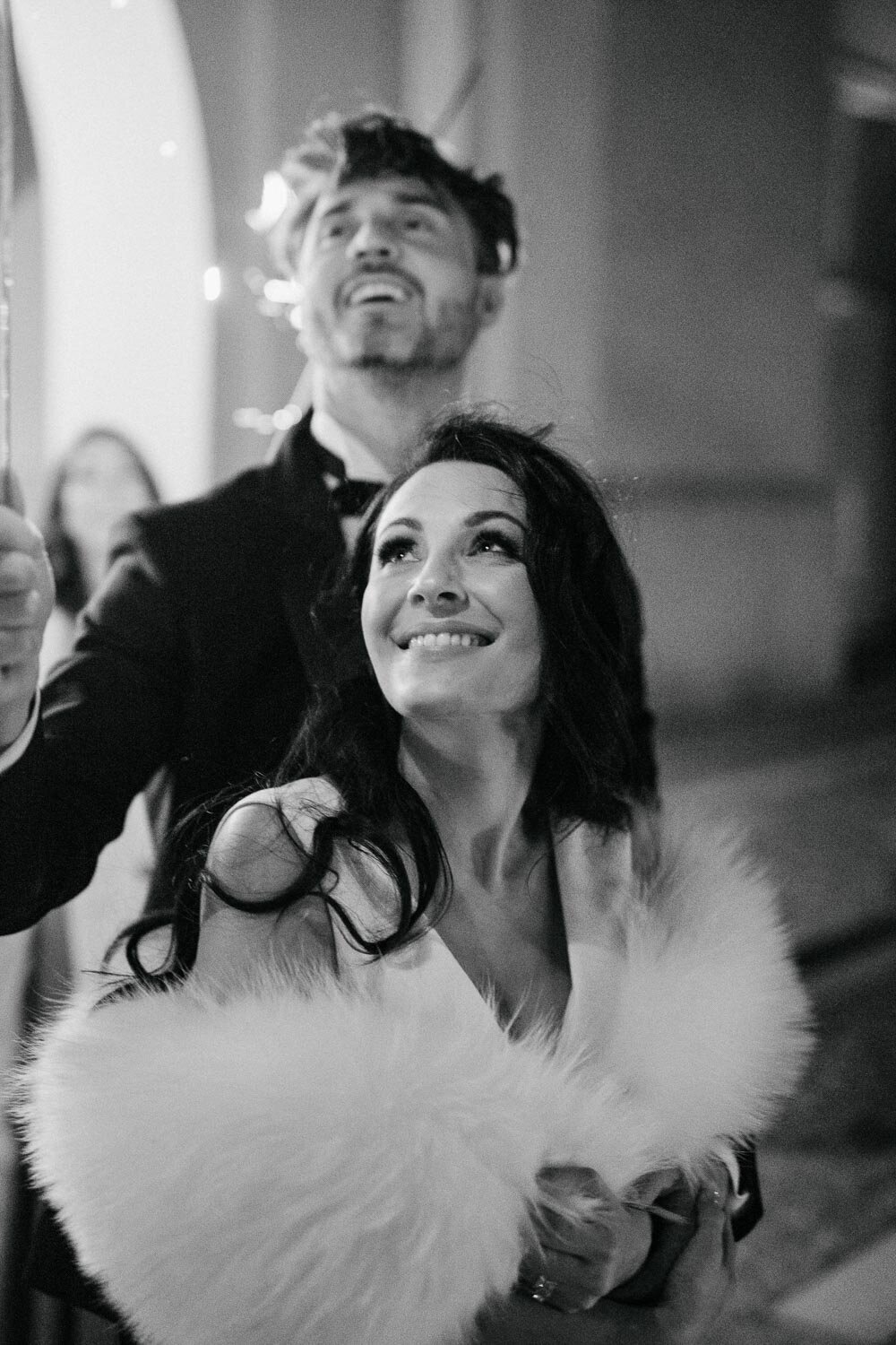black and white bride and groom celebrating