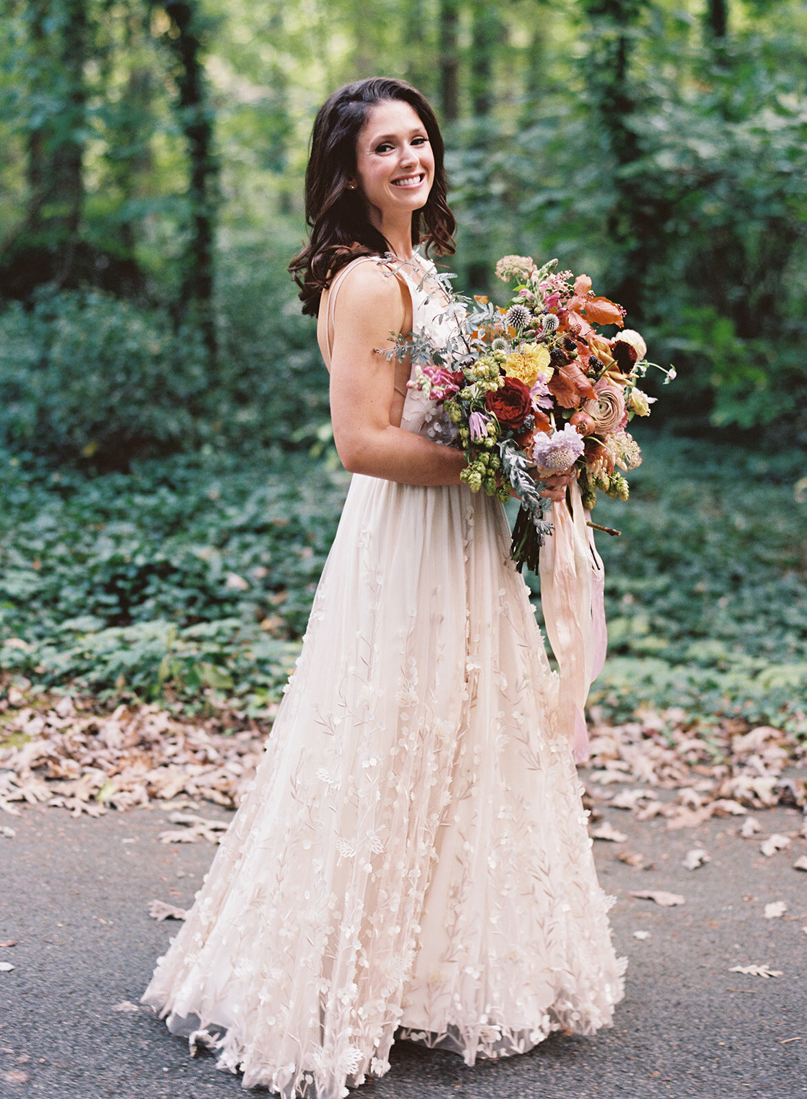 Lush, untamed bridal bouquet with garden roses, wildflowers, hops, blackberries, fruiting branches, ranunculus, copper beech, and natural greenery. Early fall RT Lodge wedding floral design by Rosemary & Finch, Nashville based florist.