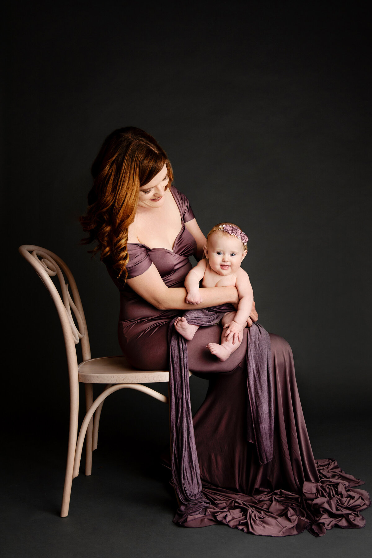 st-louis-motherhood-photographer-fine-art-photo-of-mom-in-purple-gown-holding-smiling-baby-girl