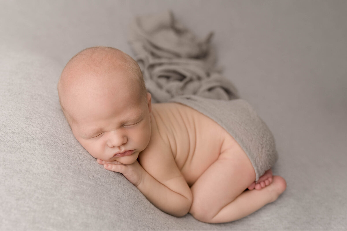 Posed sleeping newborn baby