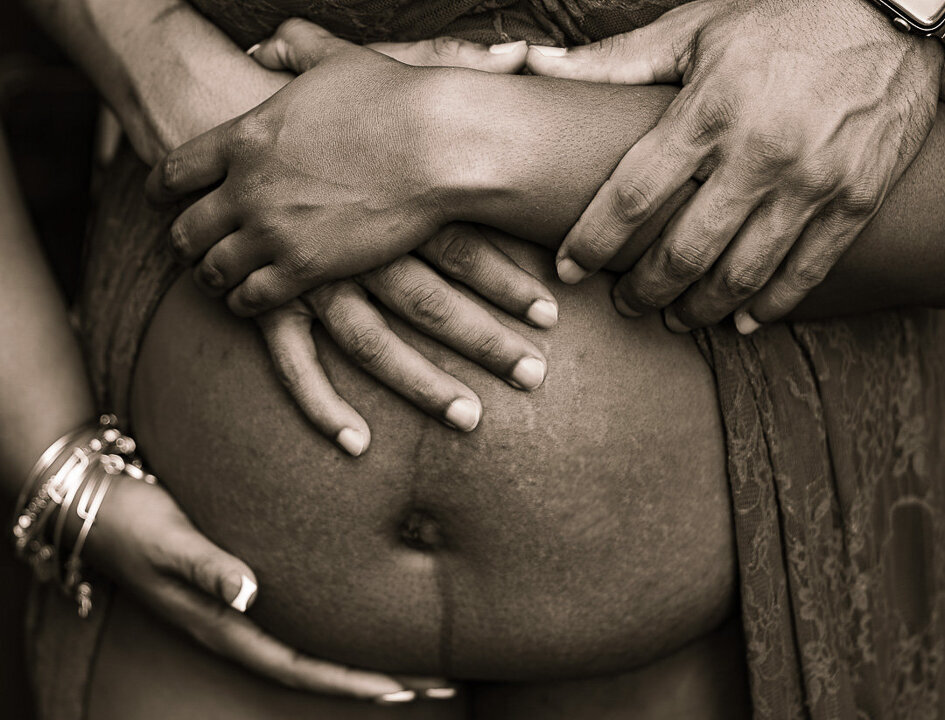 close-up of an pregnant mother's belly during a maternity shoot in atlanta georgia