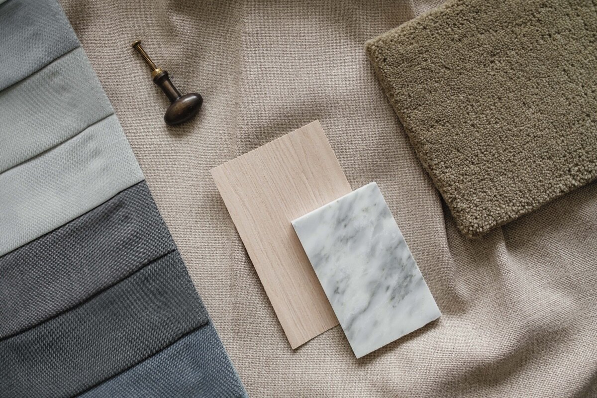 kaboompics_interior-design-material-board-home-styling-a-neutral-color-scheme-fabric-samples-35127
