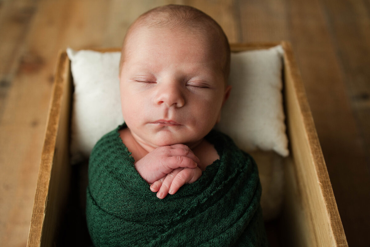 Newborn Baby Boy Wrapped in Green Wrap