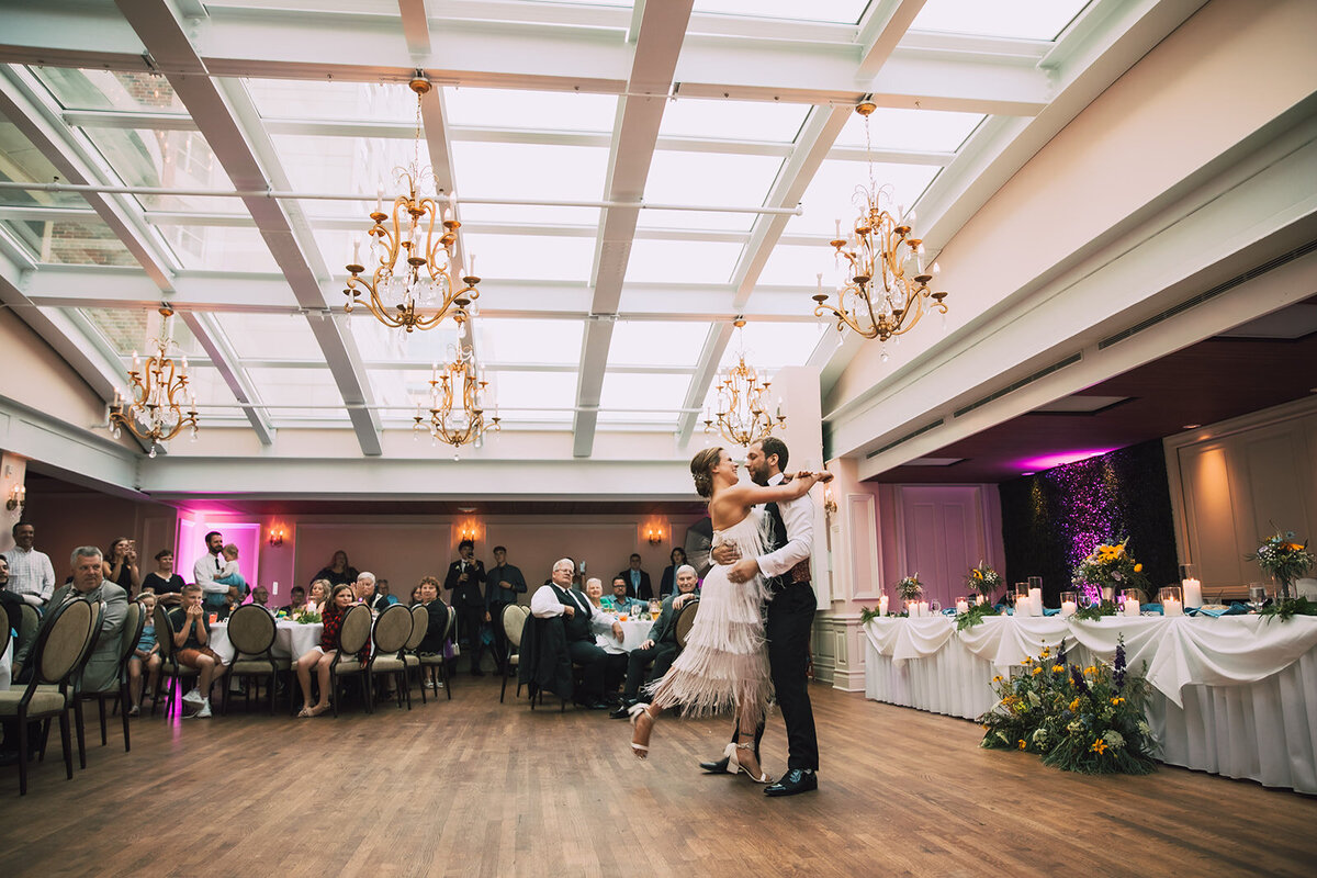 Couple dances in Madison Club Atrium