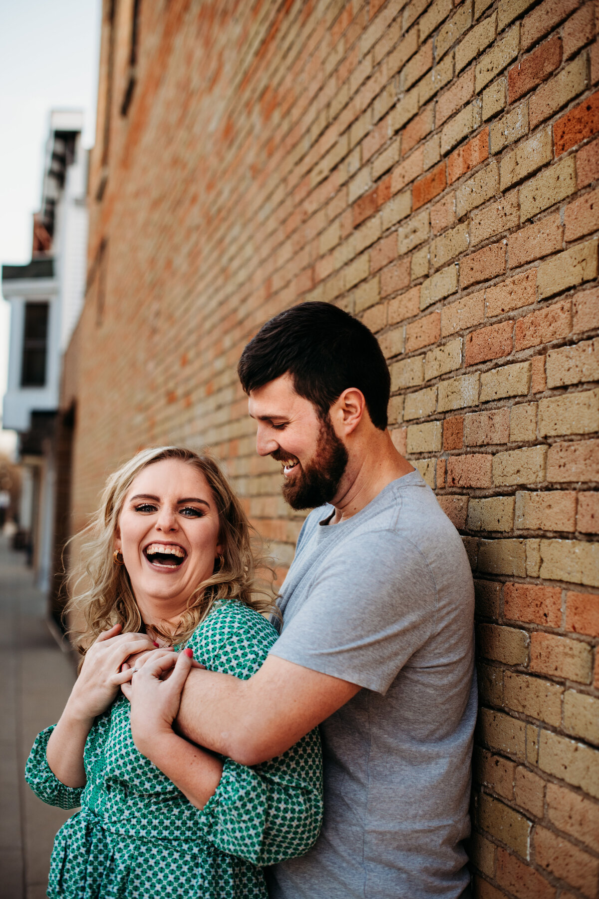 Woman laughing while man looks at her and laughs