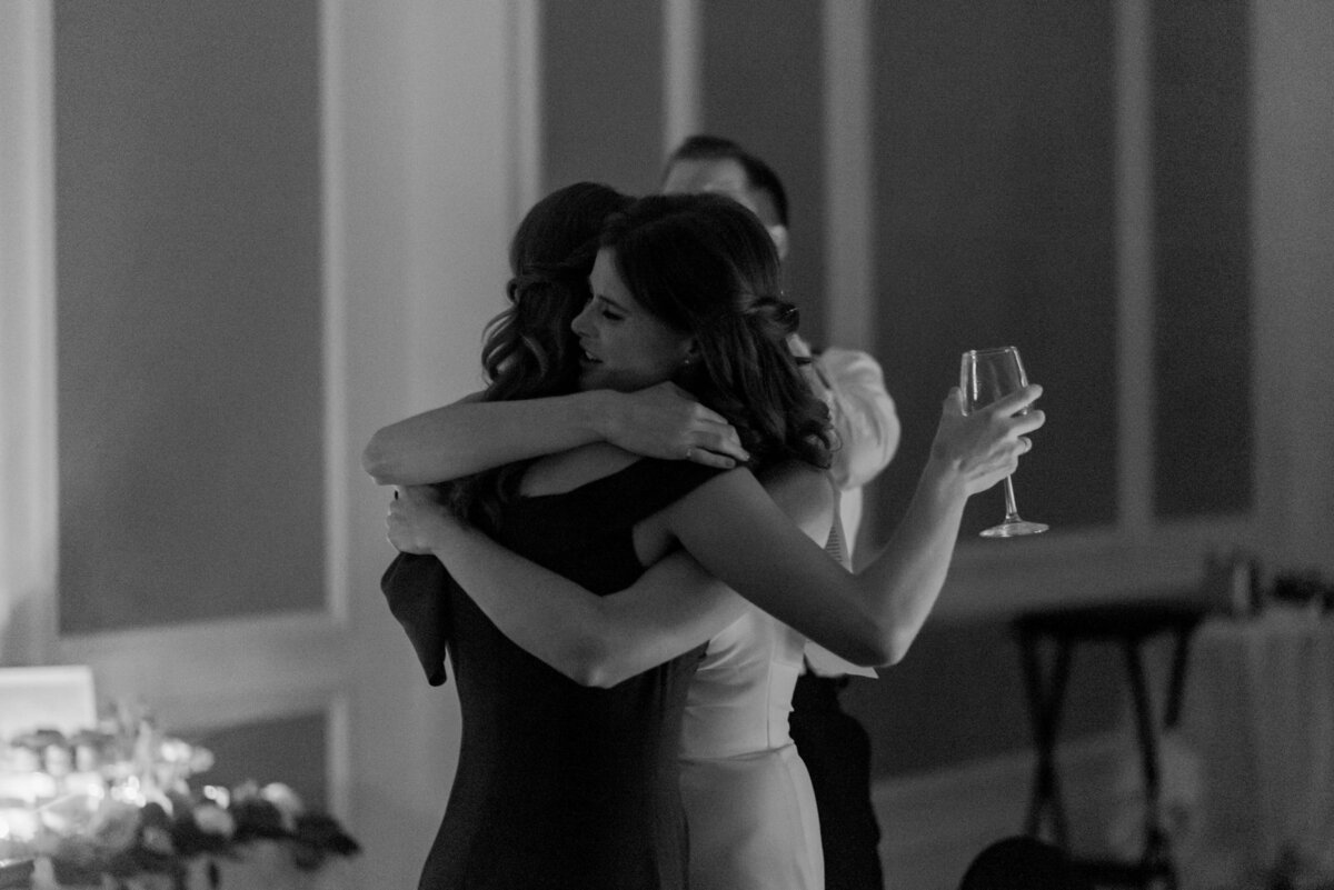 Bride hugging guest at  Lord Nelson Hotel Wedding, in Halifax, Nova Scotia