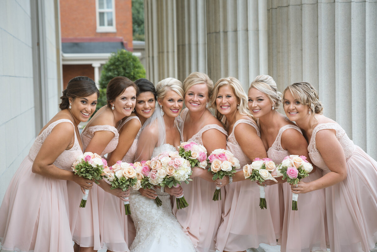 Bridesmaids at the Erie Courthouse in pink dresses.