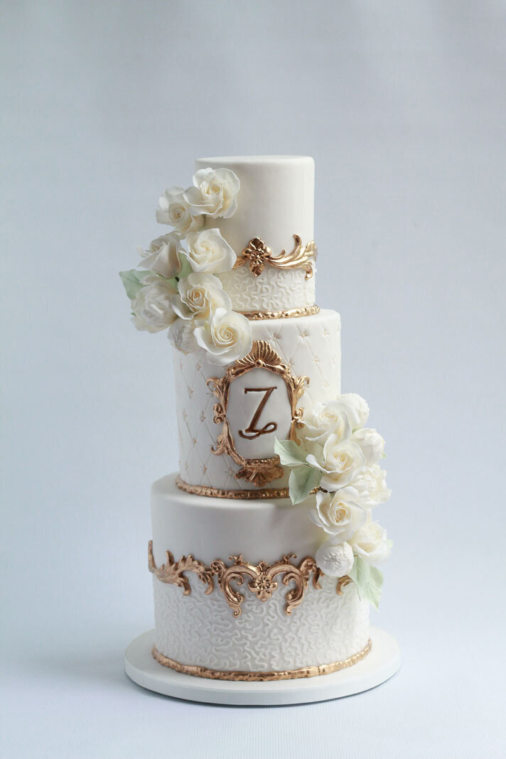 vintage ornate wedding cake with gilded details and flowers, Hamilton ON wedding cakes