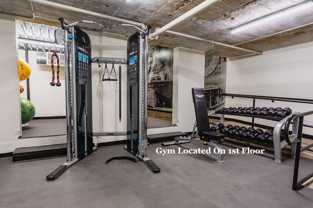 Spacious gym area on the main level of Behrens Lofts, which holds this 2 bedroom, 2.5 bathroom luxury vacation rental loft condo for 8 guests with incredible downtown views, free parking, free wifi and professional decor in downtown Waco, TX.