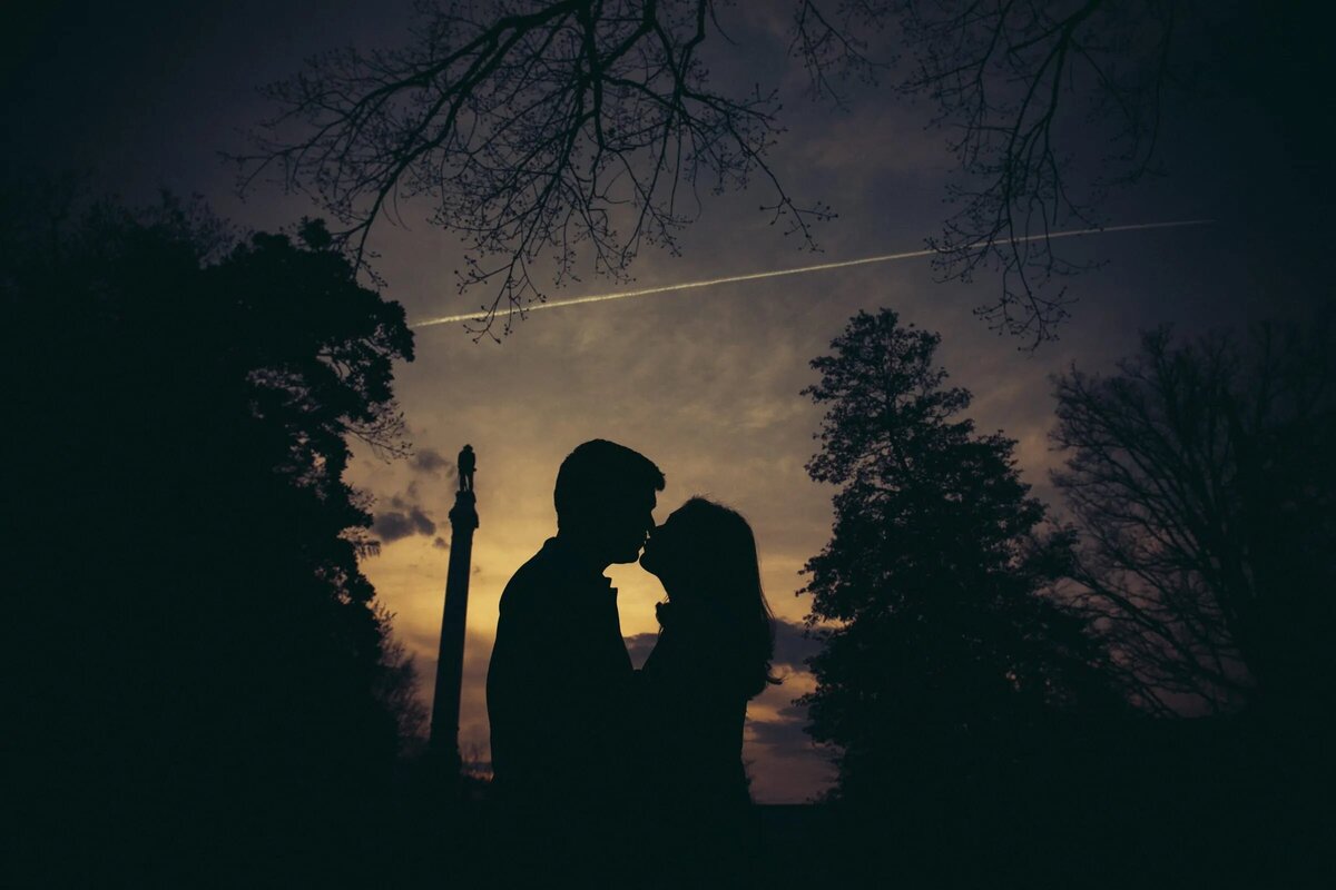 A romantic silhouette of a couple against a twilight sky