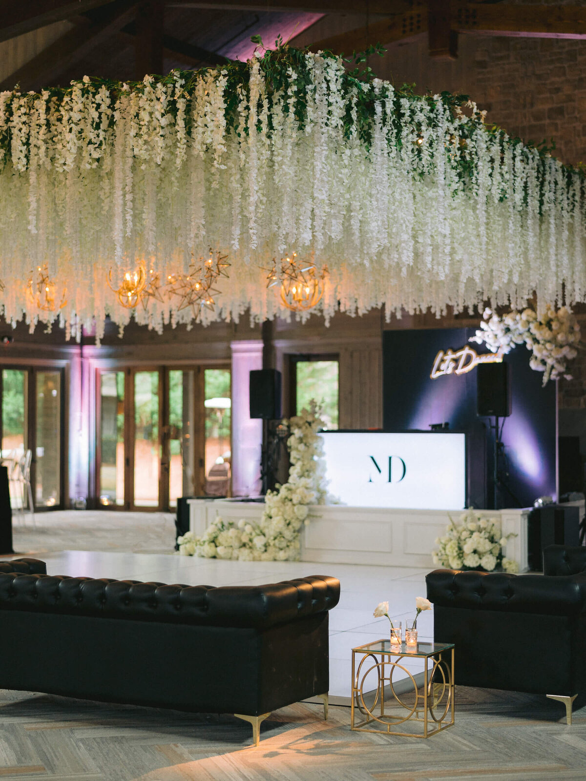 dance floor covered in wisteria and gold chandeliers