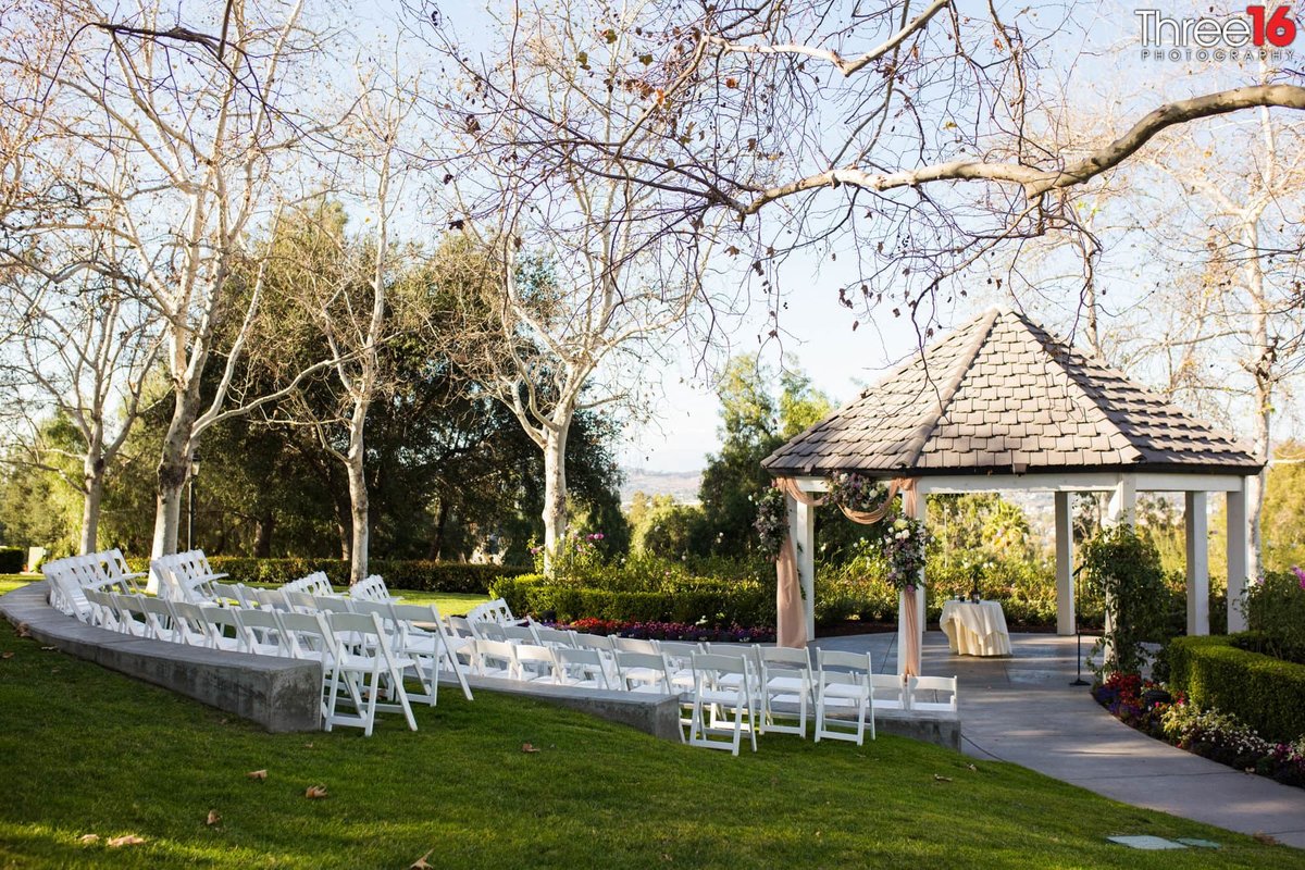 Summit House Outdoor Wedding Setup with white chairs and gazebo