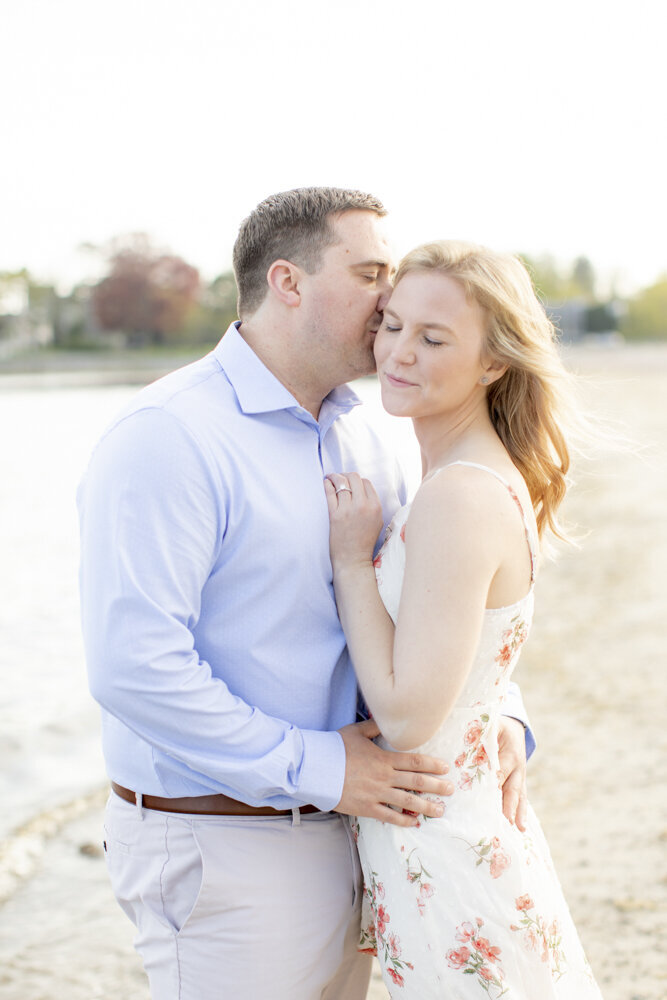 beautiful couple poses for engagement portraits with Rachel Girouard