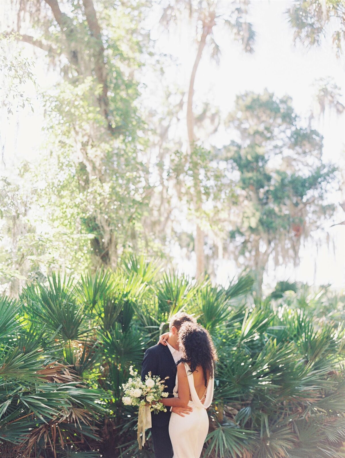 bride and groom kissing in florida