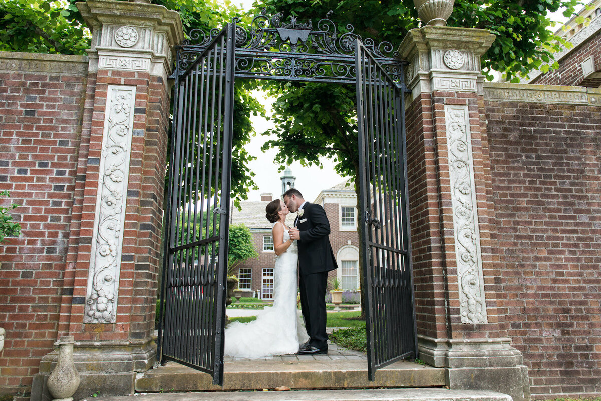 bride and groom at gateway at de Seversky Mansion