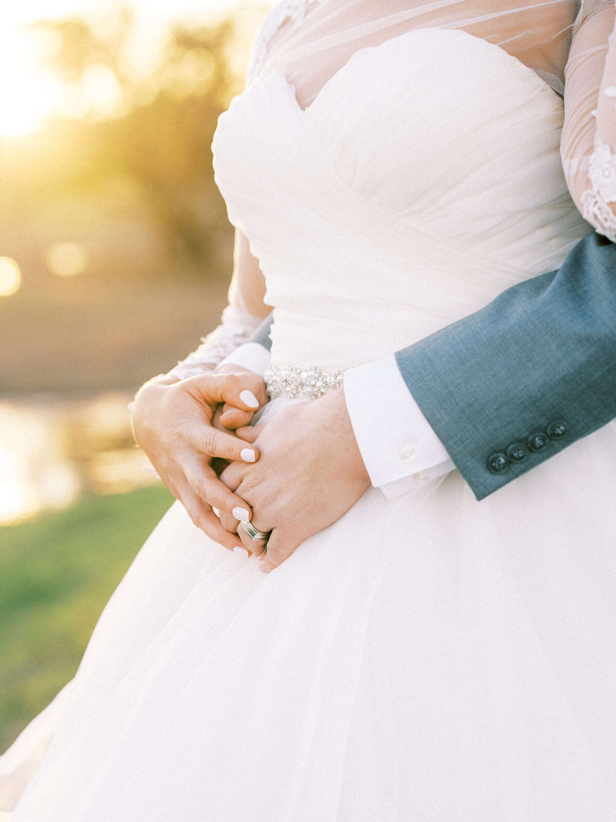 Bride and groom hold hands at spring wedding in Florence, Texas