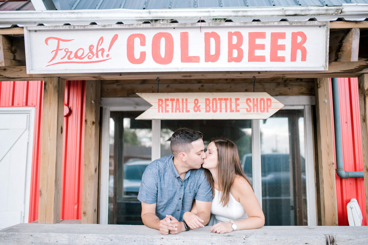 Couple kissing outside of Oast Brewery