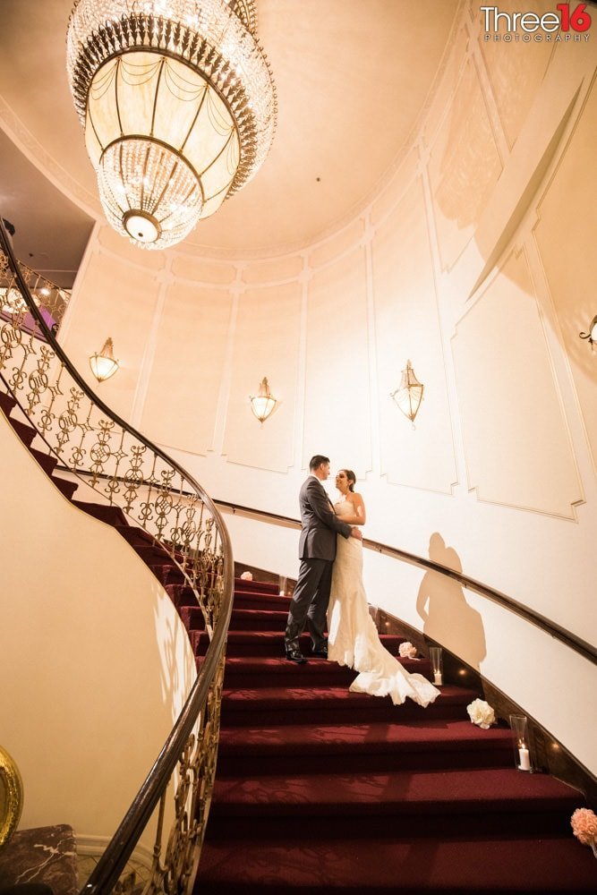 Bride and Groom share a moment on the stairwell