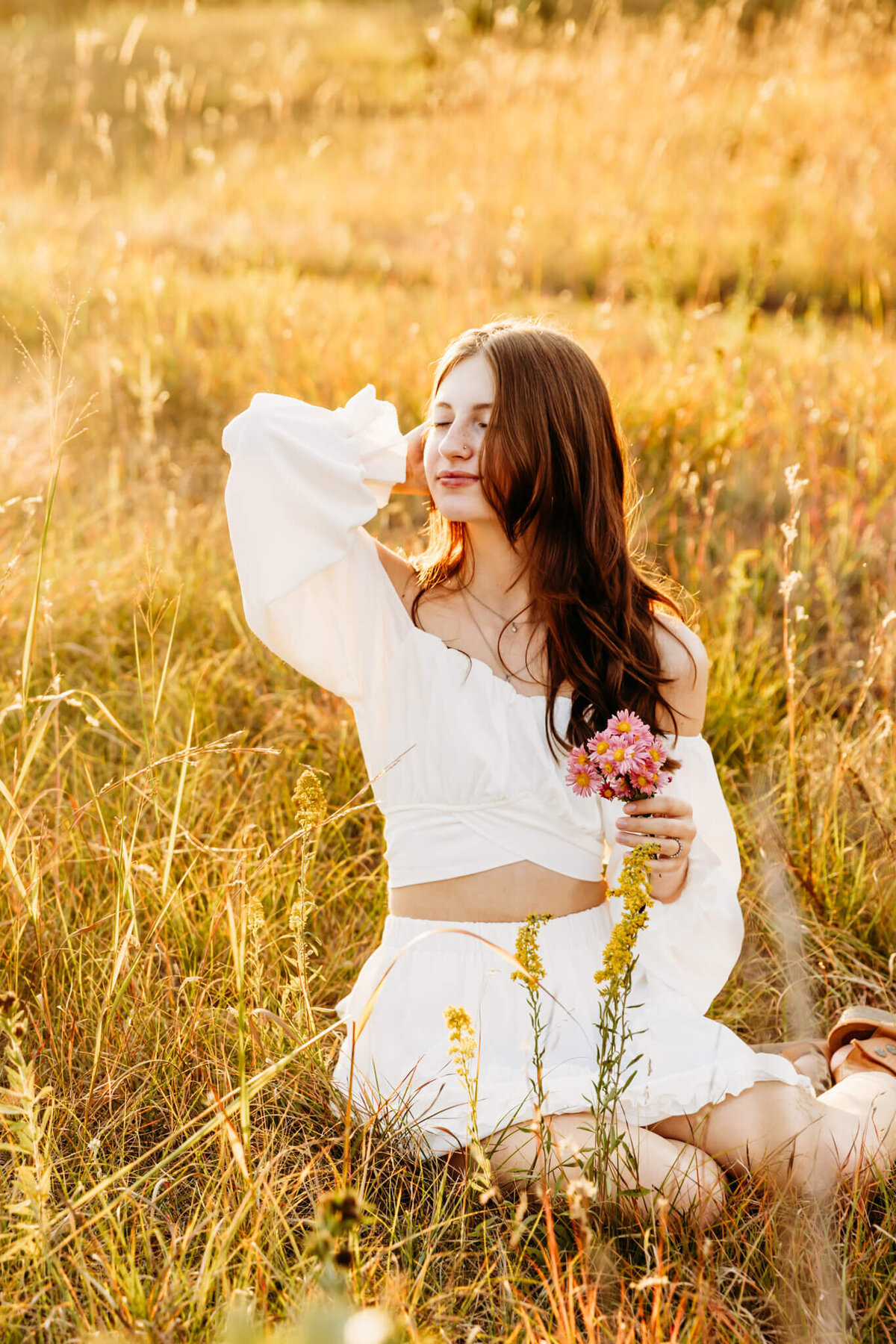 gorgeous teen girl embracing the sunshine during her senior photography experience