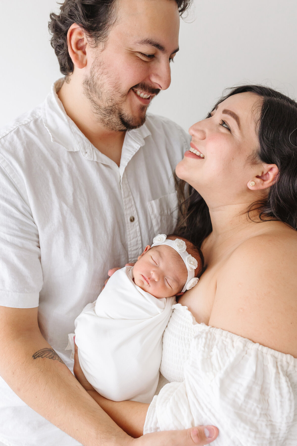 smiling parents at each other