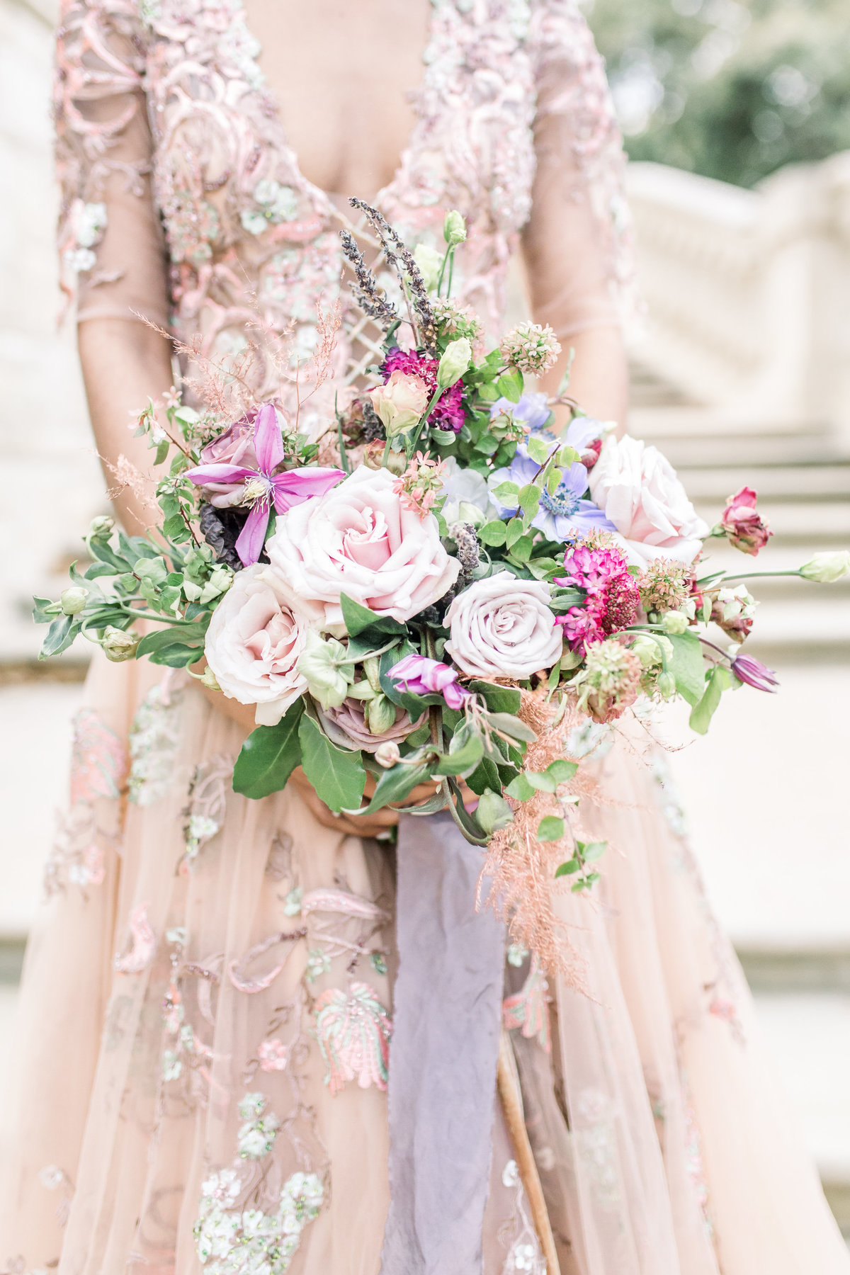 Close-up of wedding dress and floral arrangement on Rainbow Row, South Carolina