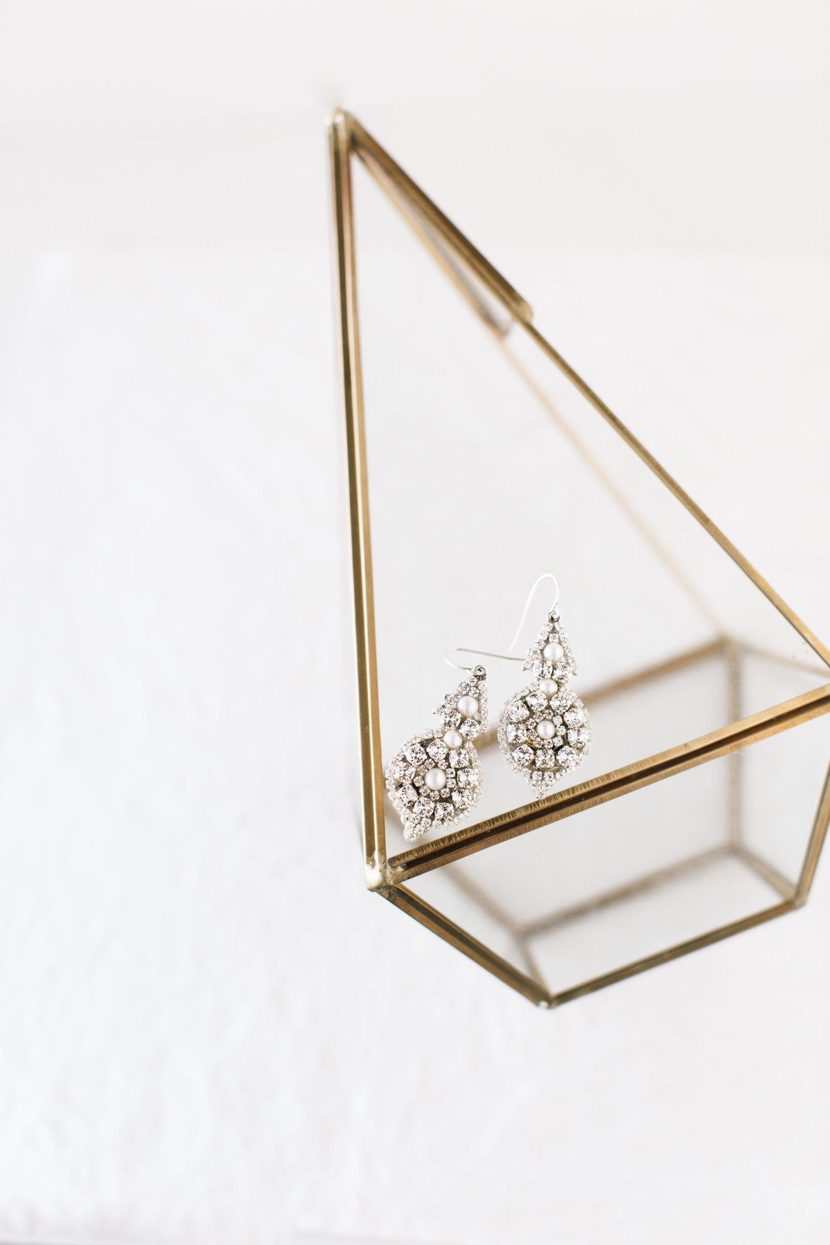 heirloom bridal jewelry photography on brass geometric