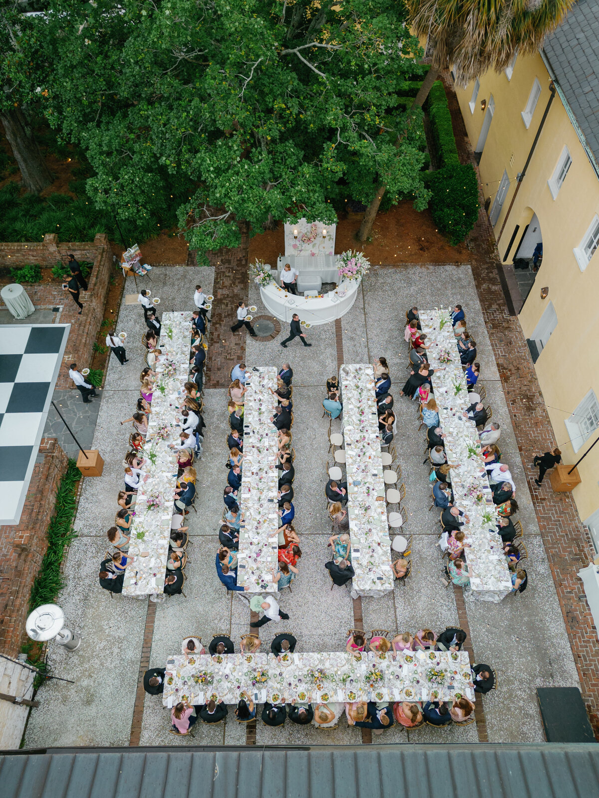Plated open-air dinner at William Aiken House spring wedding.