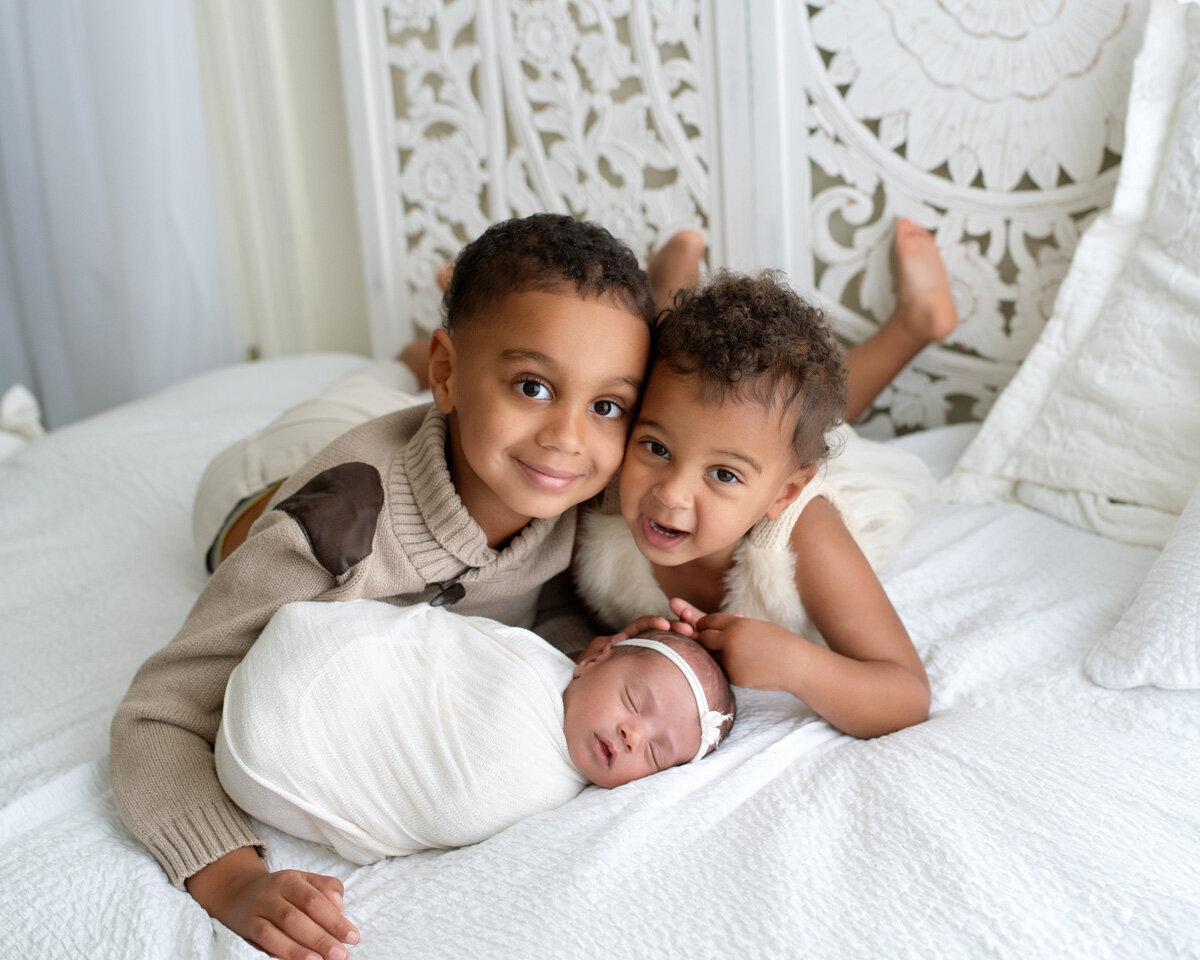 Newborn session of baby girl and two older siblings