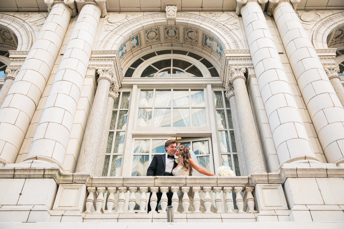 Bride and  Groom on the balcony at the Hermitage Hotel.