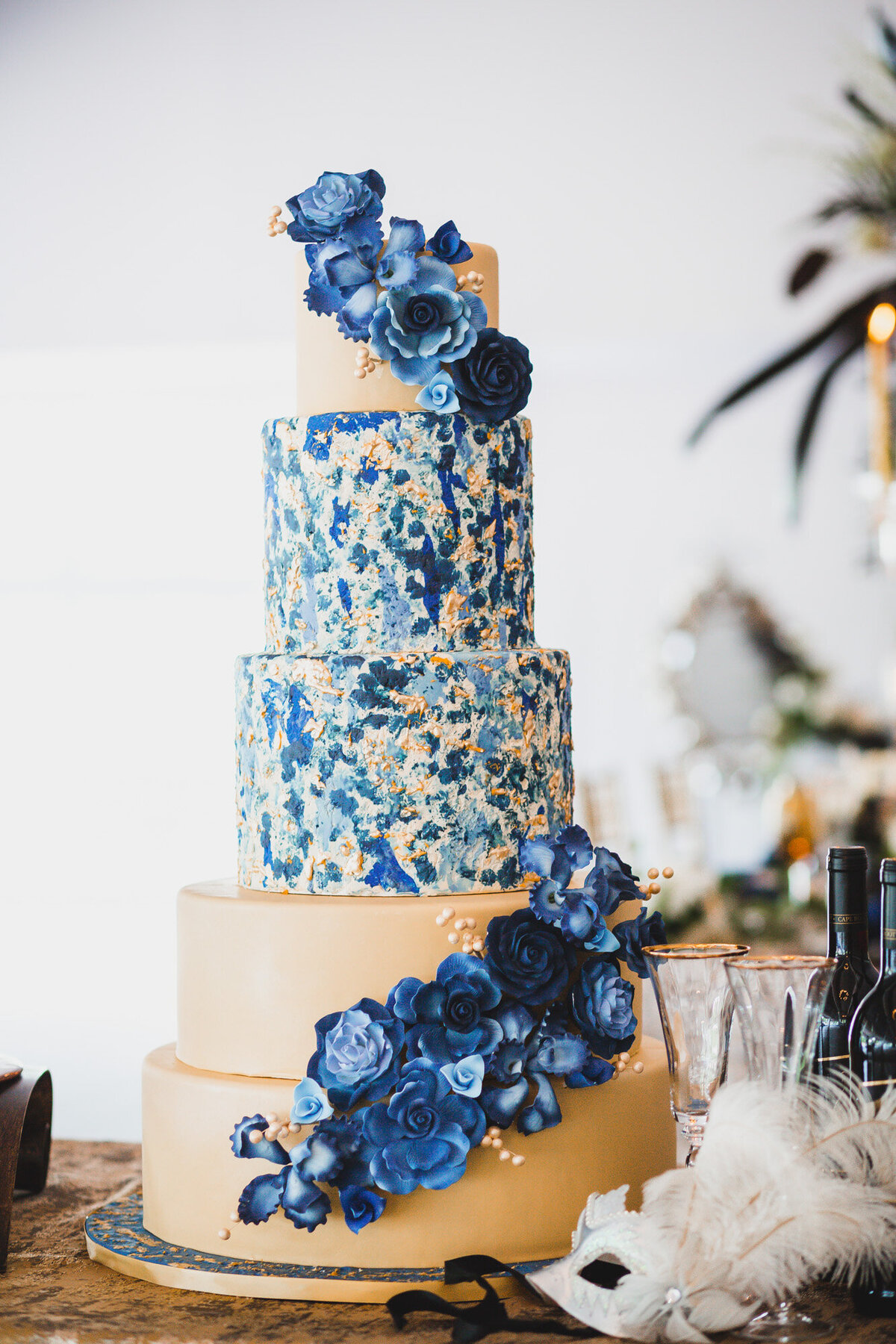 Elegant five tier cake with blue and floral details