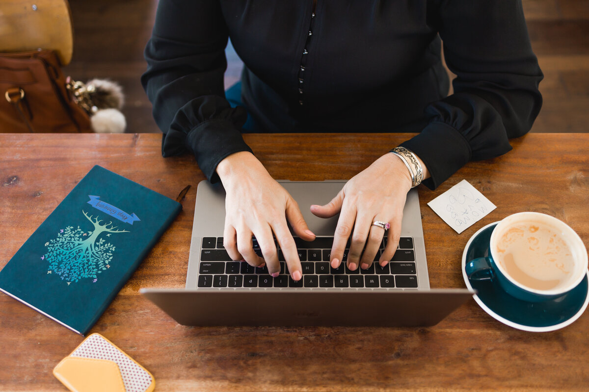 woman typing on a laptop