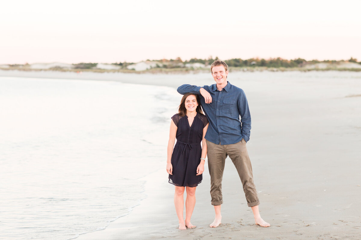 couple standing on beach in New England