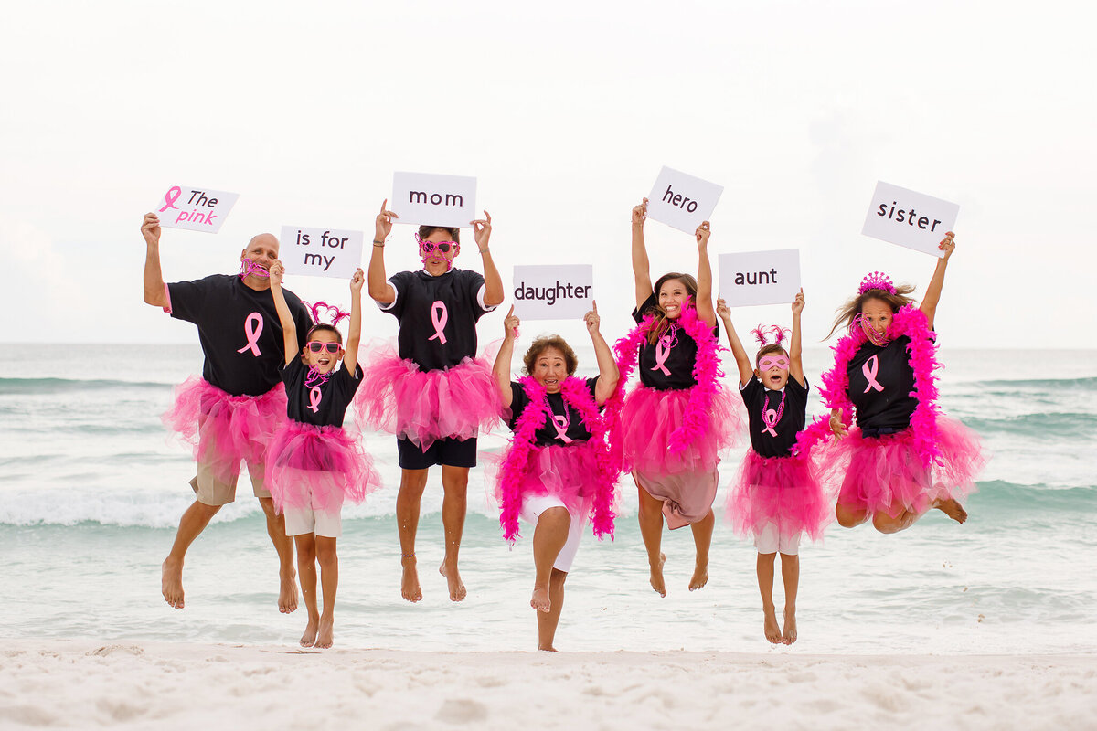 cancer phot on beach in pink tutus