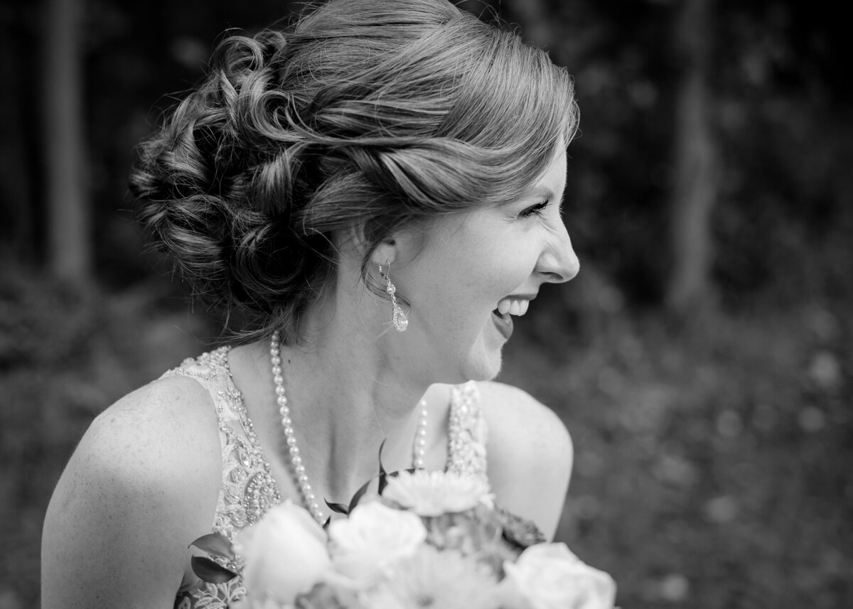 black and white images of bride laughing with nose crinkles