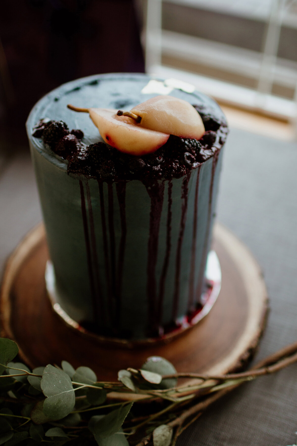 A unique blue wedding cake with pears captured by Fort Worth Wedding Photographer, Megan Christine Studio