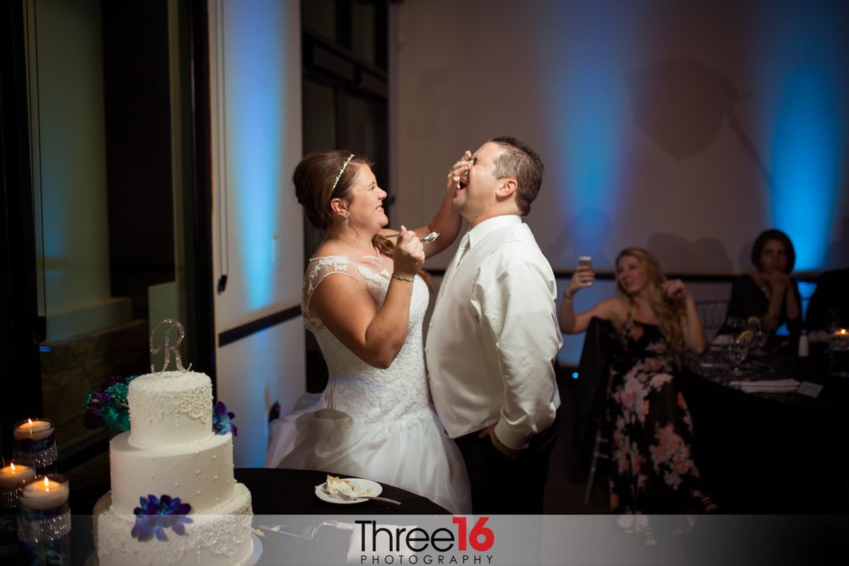Bride smashes cake into Groom's face