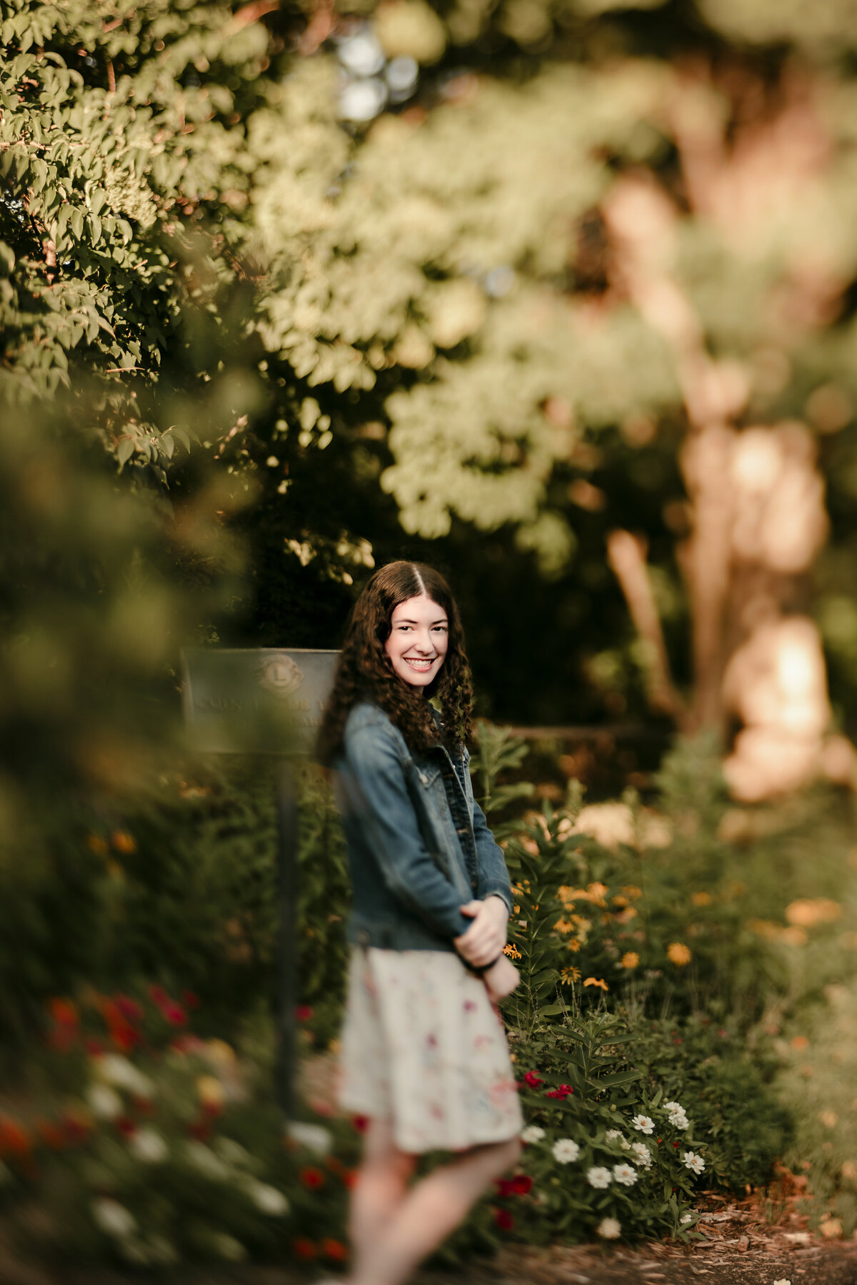 creative portrait of girl posing with nature and flowers in Coon Rapids, MN