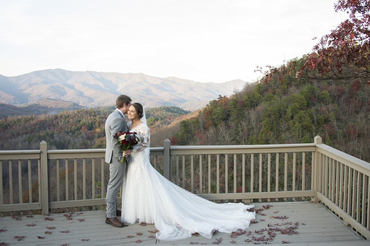 Couple hugging mountain views Hawkesdene wedding Asheville, NC