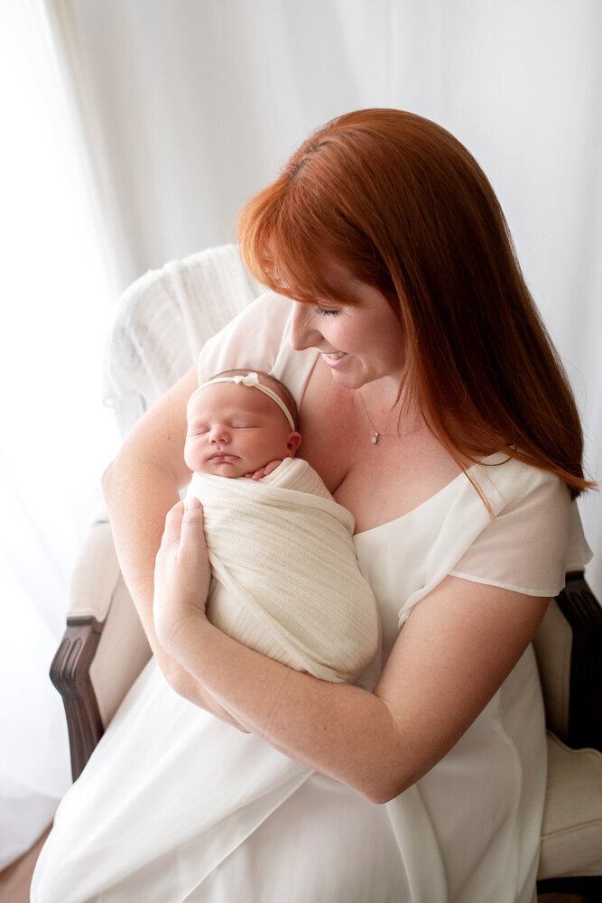 Newborn session of baby girl and mother