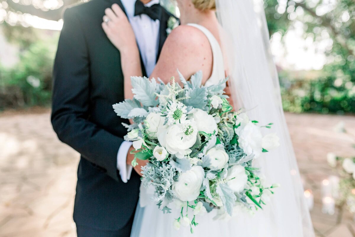 bride and groom with white bouquet