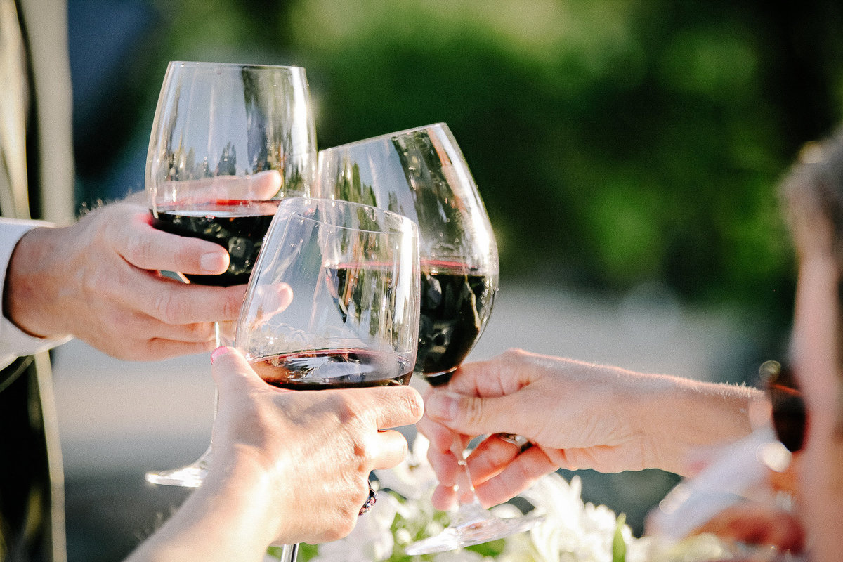 A wedding toast with red wine from Maroon Winery in Napa.
