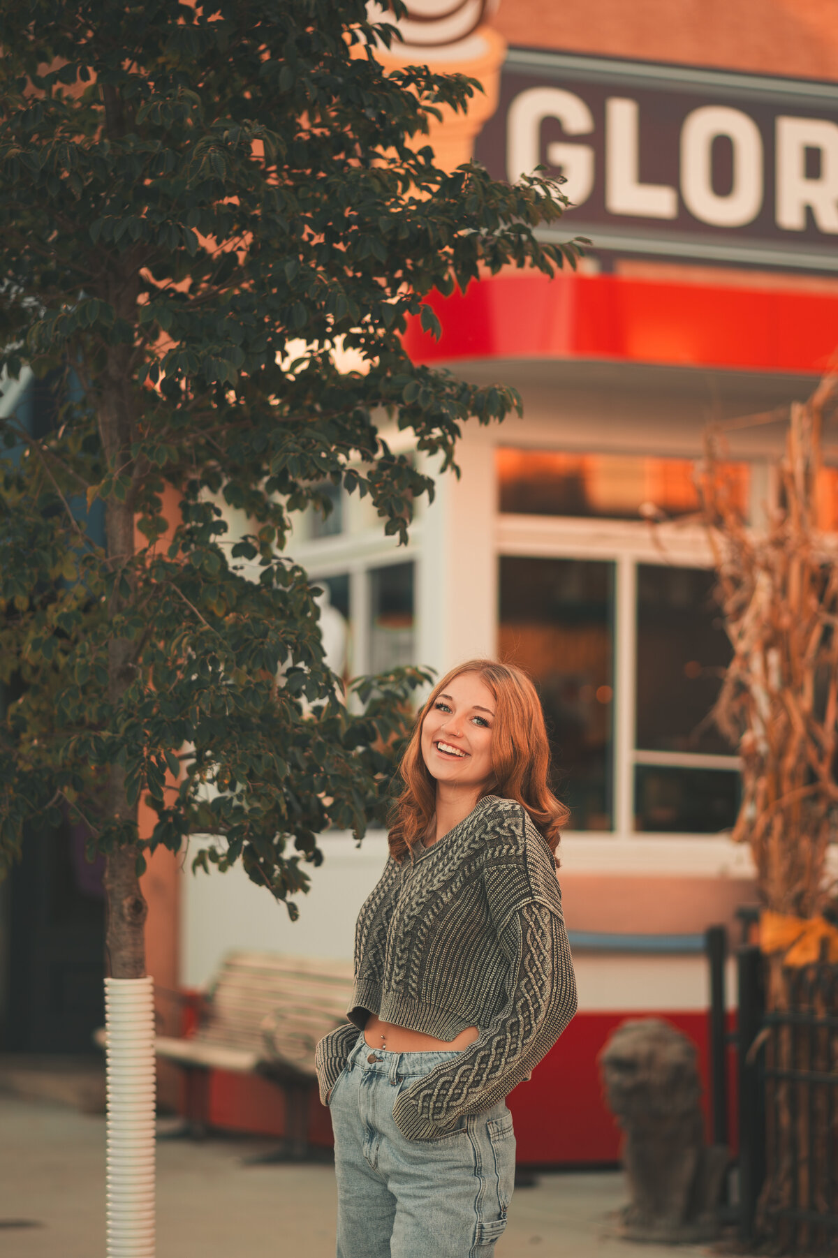 Young female standing next to an ice cream shop in downtown Stillwater, MN
