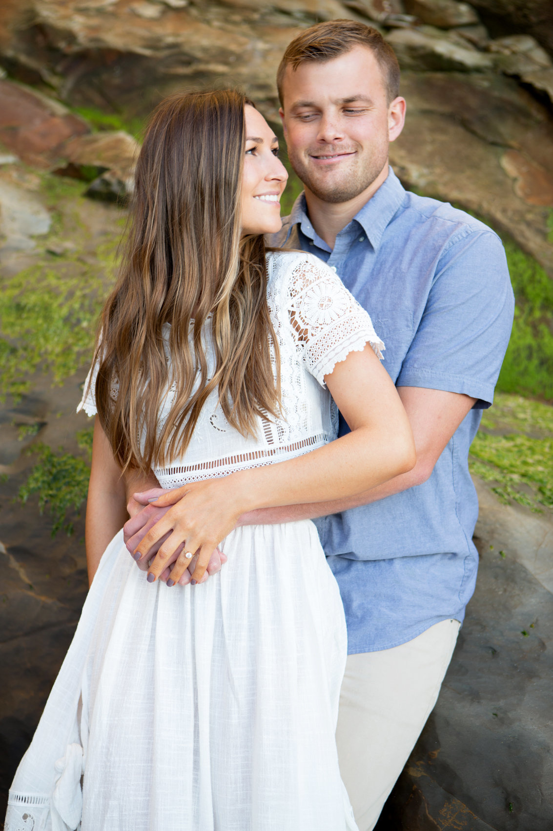 Engagement session beach, portrait of young couple on rocks, outdoor photo session northern california