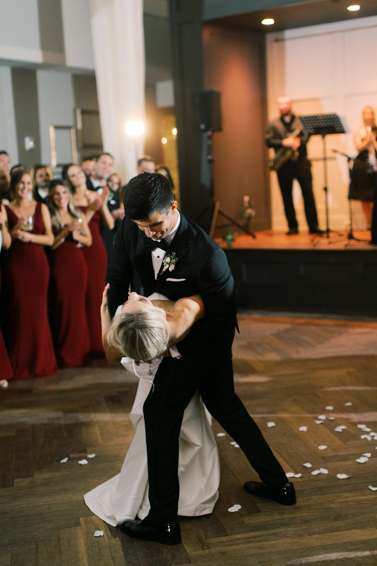 groom dipping bride while dancing during first dance