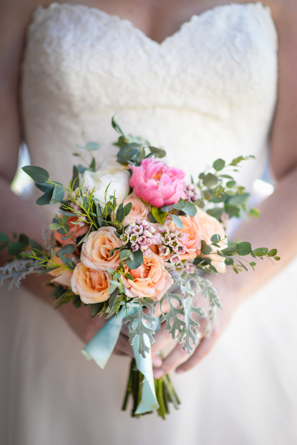 Beautiful NOLA Wedding Photography: Brides bouquet with pink, peach and green by Leaf + Petal at Race & Religious