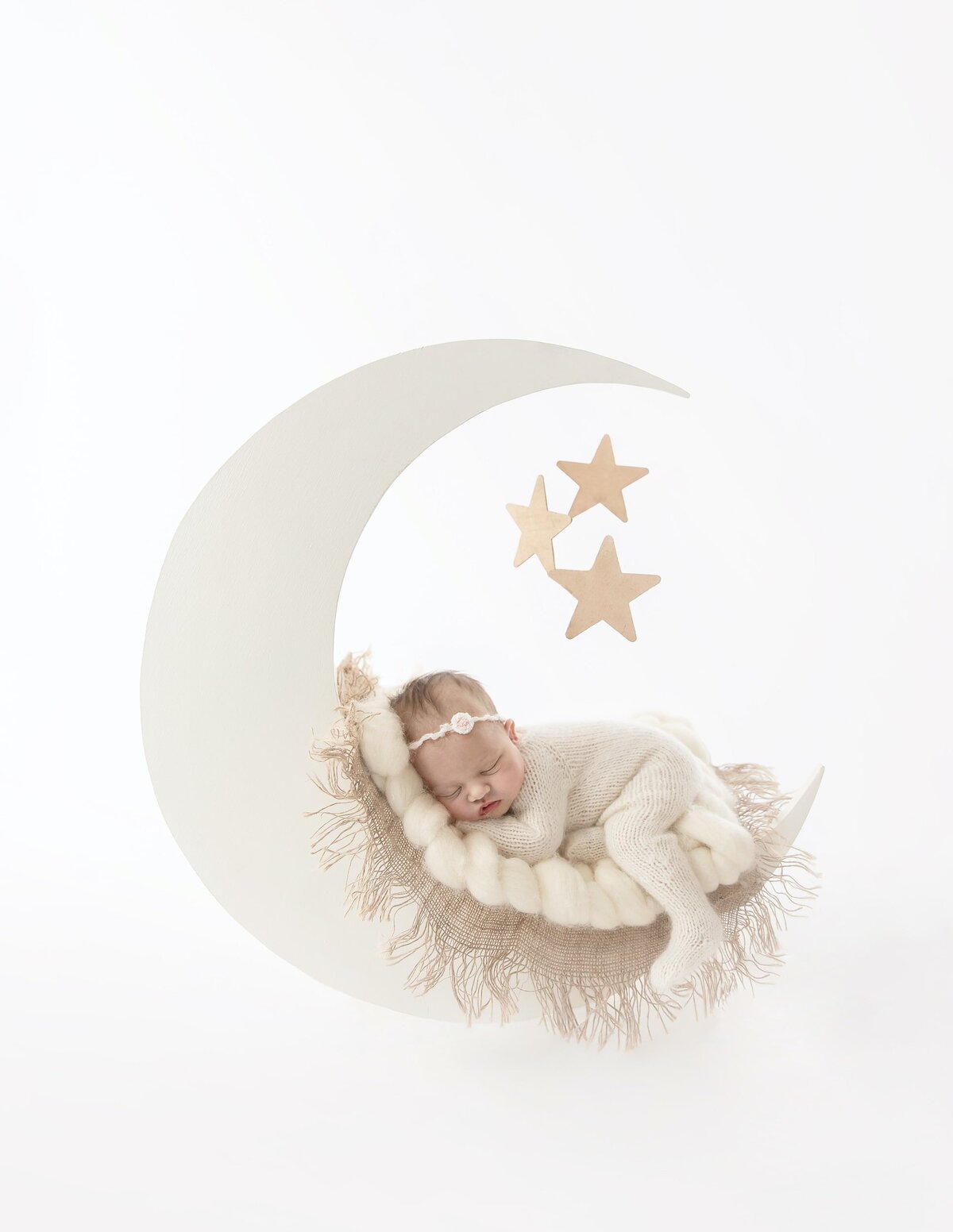 Newborn girl on moon and stars