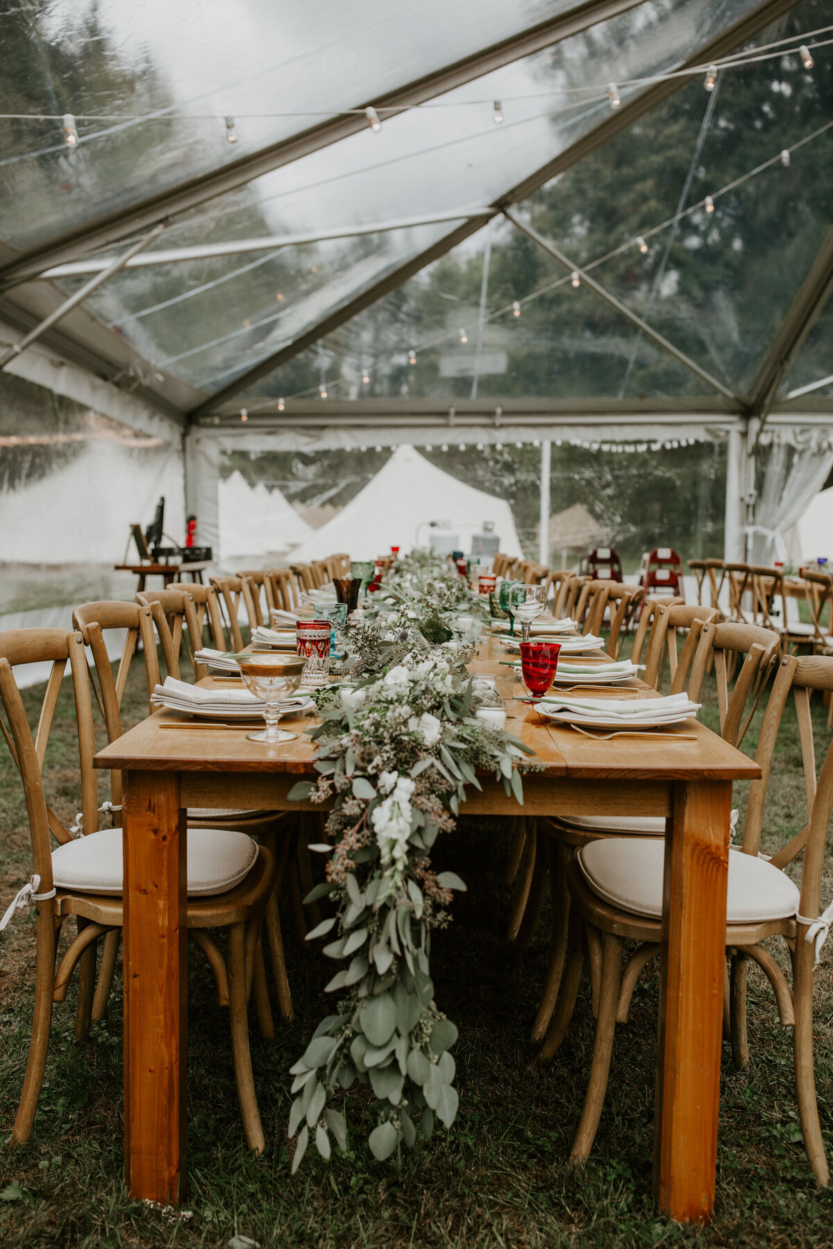 Clear tented rustic wedding reception