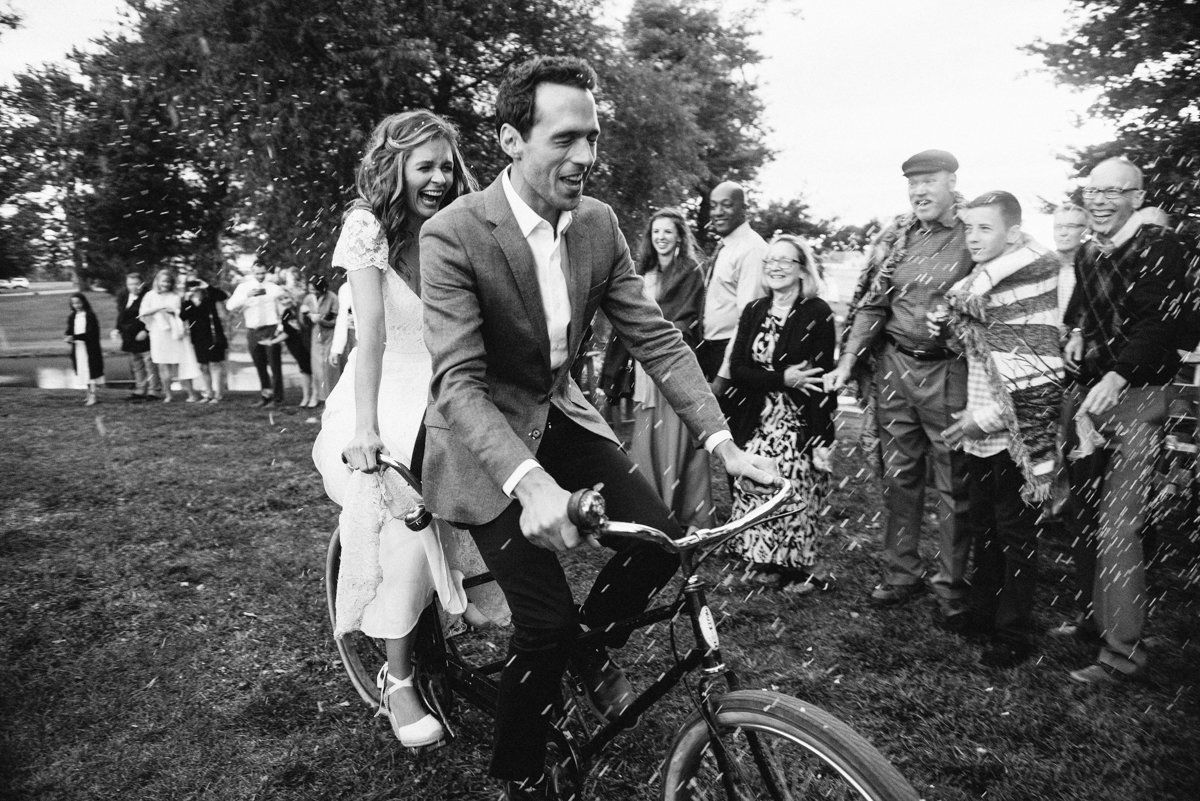 epic wedding entrance on a bicycle made for two